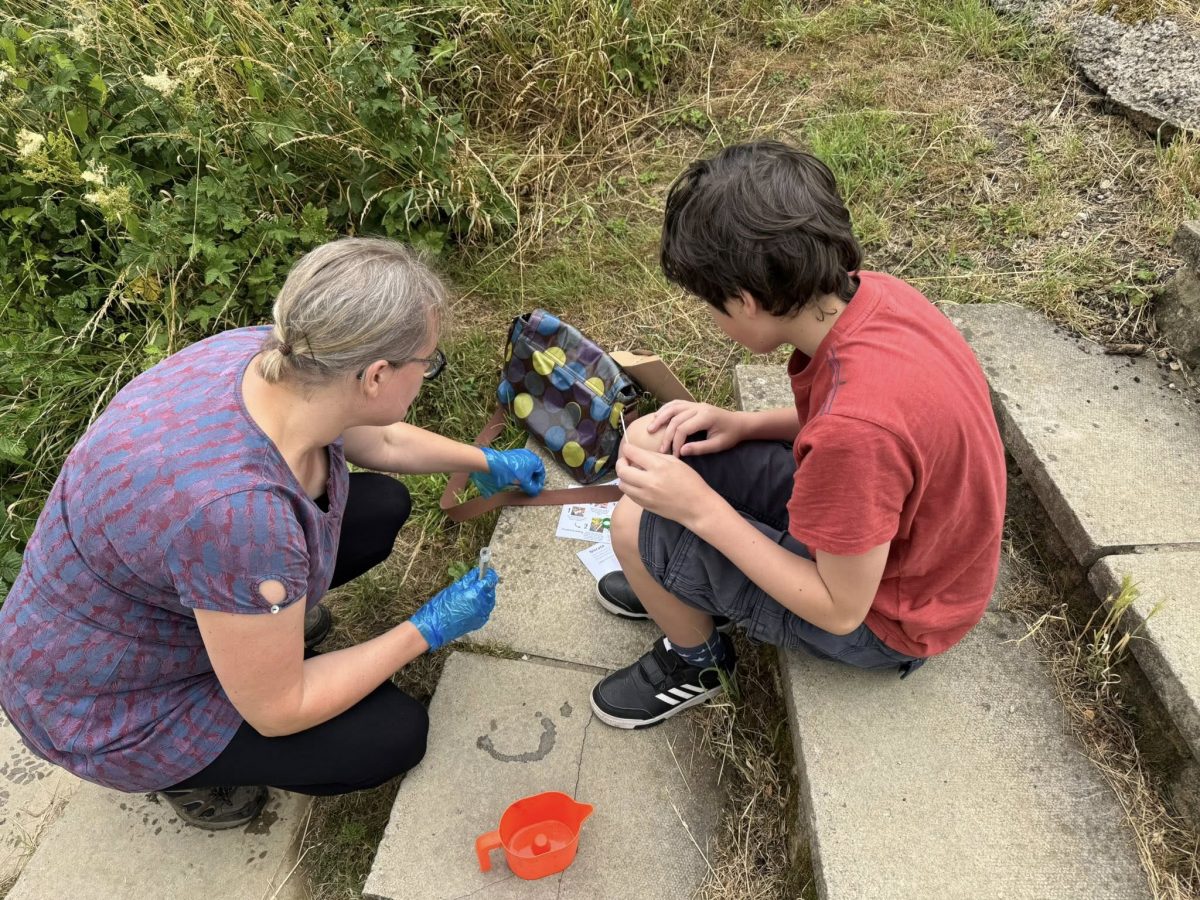 Members of the Calne community collect samples from Abberd Brook